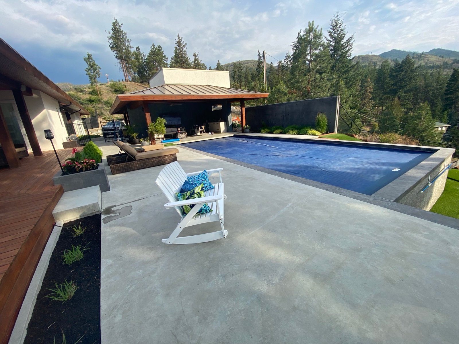 Hillside pool and pavilion with mountain views