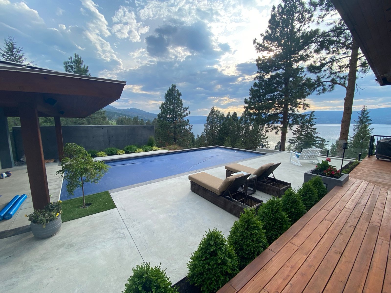 Covered pool and lounge deck overlooking Okanagan Lake